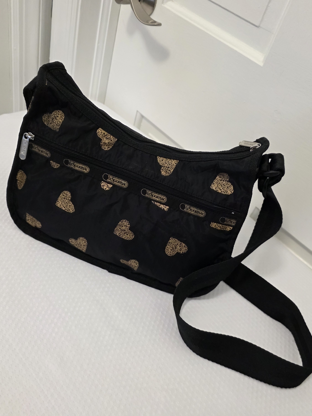 LeSportsac Black Crossbody Bag with Gold Heart Print, Razzmatazz, Fun